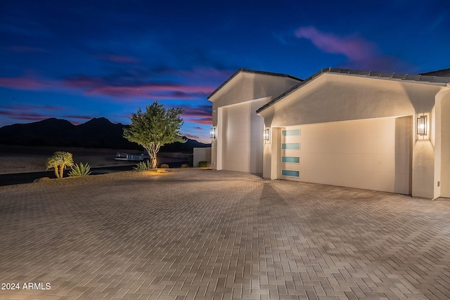 view of front of house featuring a mountain view and a garage