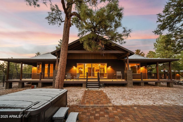 2702 Majestic Elk Rd, Overgaard, AZ 85933 - back of house at dusk featuring a deck