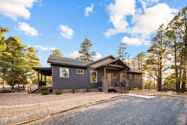 2702 Majestic Elk Rd, Overgaard, AZ 85933 - view of front facade featuring a shingled roof and covered porch