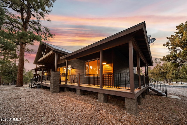 2702 Majestic Elk Rd, Overgaard, AZ 85933 - rear view of property featuring covered porch