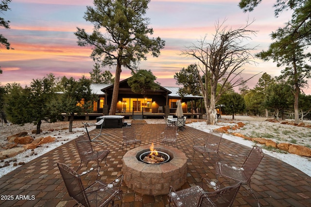 2702 Majestic Elk Rd, Overgaard, AZ 85933 - view of patio featuring an outdoor fire pit and a wooden deck