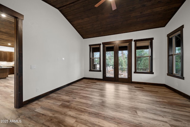 2702 Majestic Elk Rd, Overgaard, AZ 85933 - empty room featuring french doors, wood ceiling, wood finished floors, and lofted ceiling