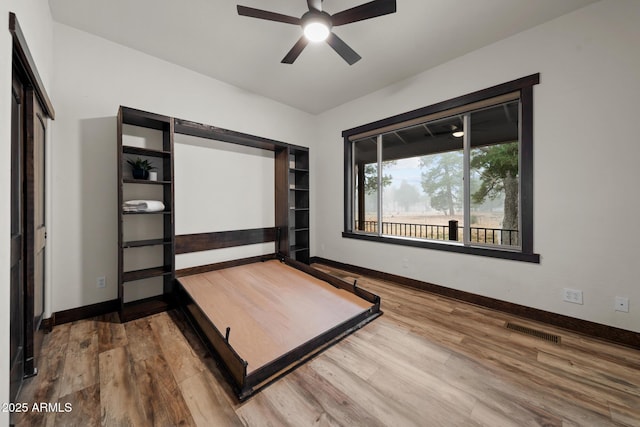 2702 Majestic Elk Rd, Overgaard, AZ 85933 - unfurnished bedroom featuring visible vents, baseboards, and wood finished floors