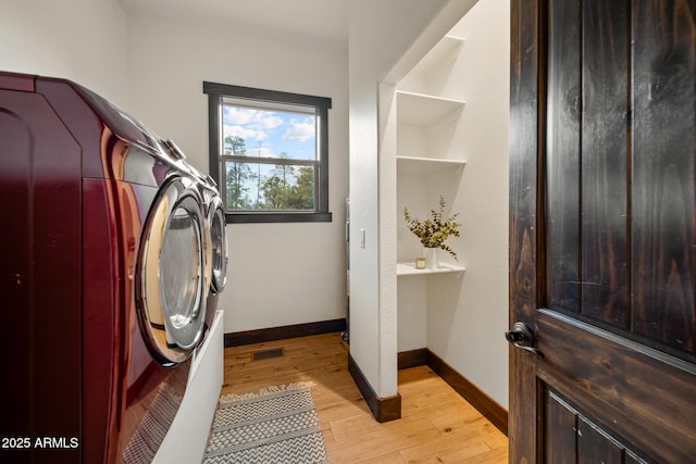 2702 Majestic Elk Rd, Overgaard, AZ 85933 - washroom featuring light wood-style floors, baseboards, laundry area, and visible vents
