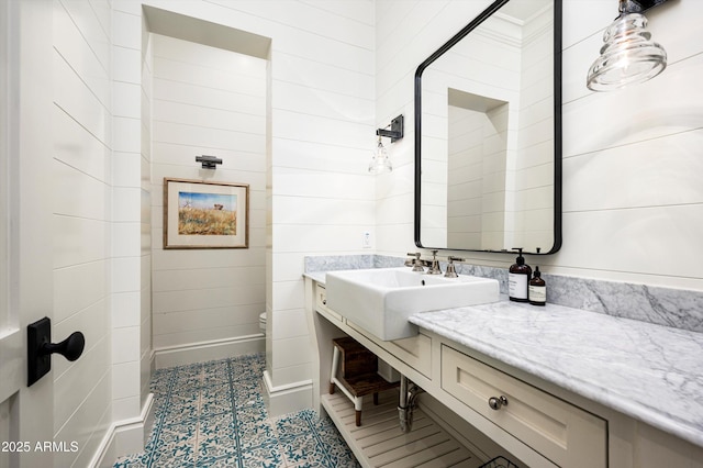 bathroom with toilet and vanity