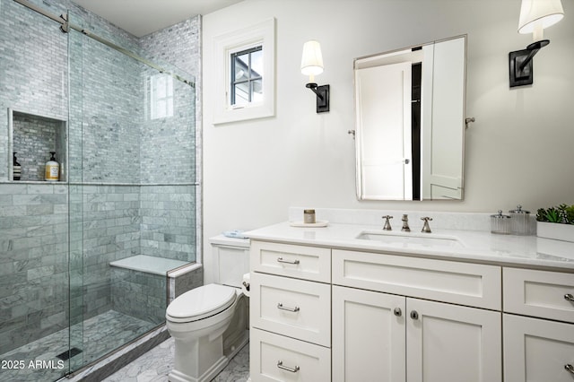 bathroom with a stall shower, marble finish floor, vanity, and toilet