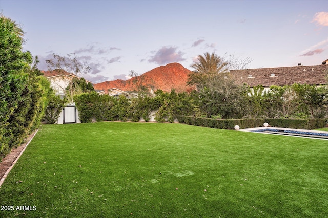 view of yard with a mountain view and an outdoor pool