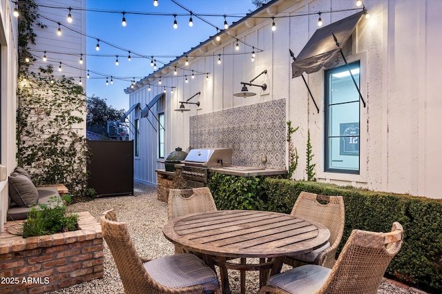 view of patio with outdoor dining space and a grill