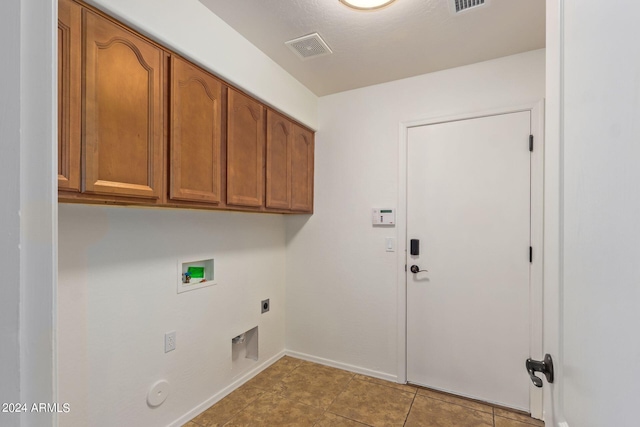 washroom with cabinets, hookup for a washing machine, light tile patterned flooring, electric dryer hookup, and hookup for a gas dryer