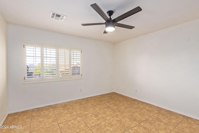 unfurnished room featuring light tile patterned flooring and ceiling fan