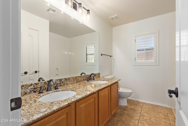 bathroom featuring vanity, toilet, and tile patterned floors