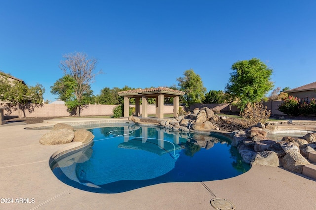 view of swimming pool with a patio