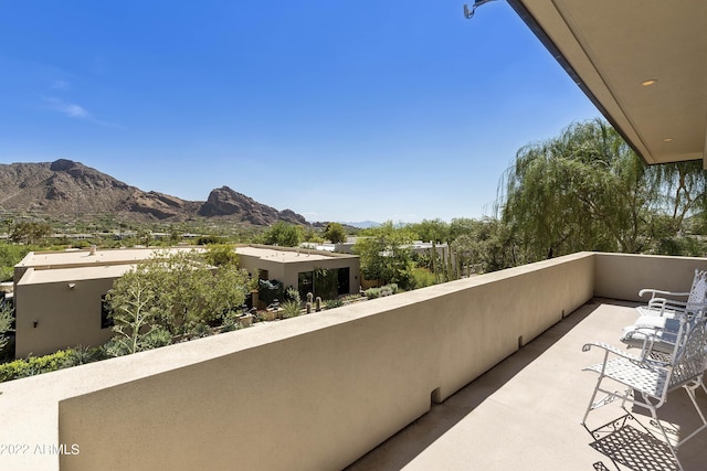 balcony featuring a mountain view