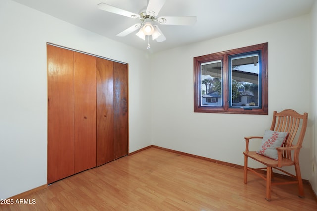 bedroom with ceiling fan, a closet, and light wood-type flooring