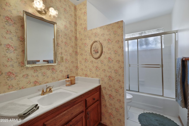 full bathroom featuring tile patterned flooring, enclosed tub / shower combo, vanity, and toilet