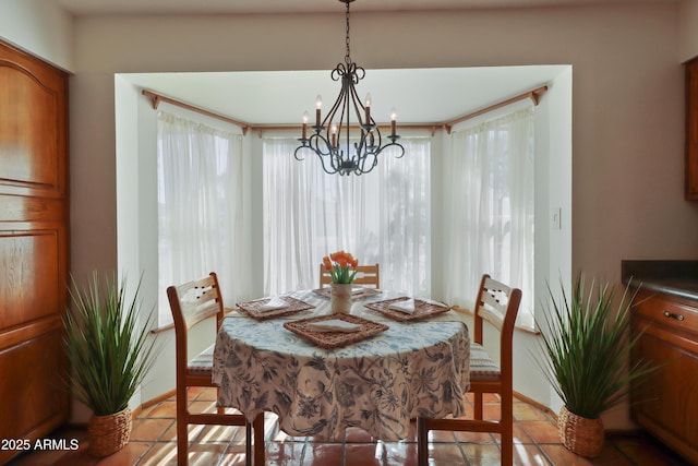 dining room featuring light tile patterned flooring and an inviting chandelier