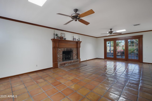 unfurnished living room with a brick fireplace, crown molding, tile patterned floors, and ceiling fan