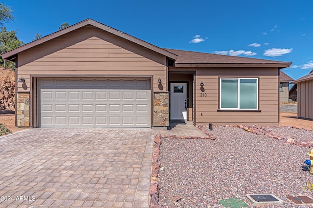 ranch-style home featuring a garage