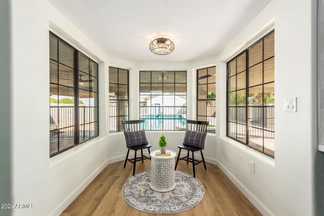 living area with hardwood / wood-style floors