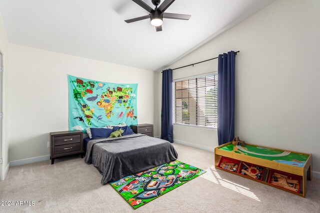 carpeted bedroom with ceiling fan and vaulted ceiling