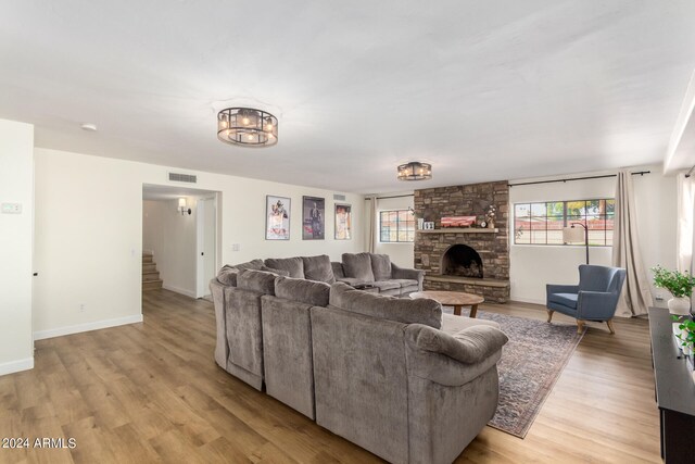 living room featuring a fireplace and light hardwood / wood-style flooring