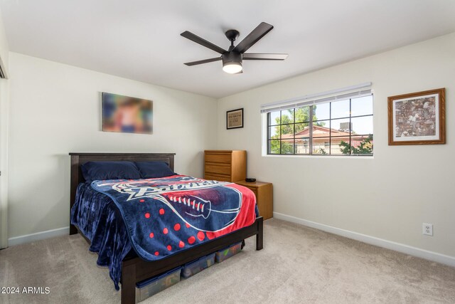 bedroom with ceiling fan and light colored carpet