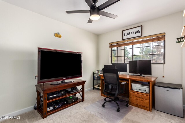 office featuring ceiling fan and light carpet