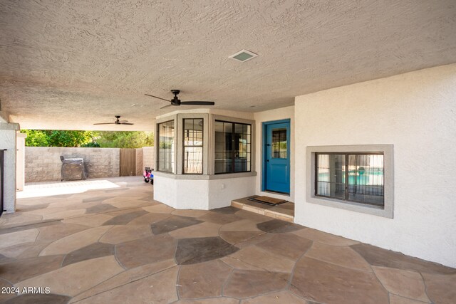 view of patio featuring ceiling fan