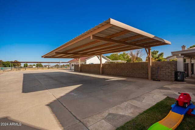 exterior space with a carport