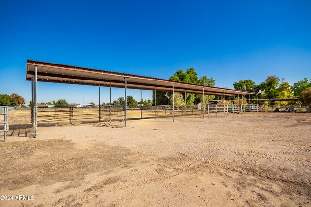 view of stable featuring a rural view