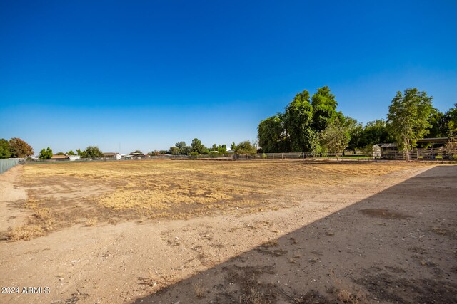 view of yard with a rural view