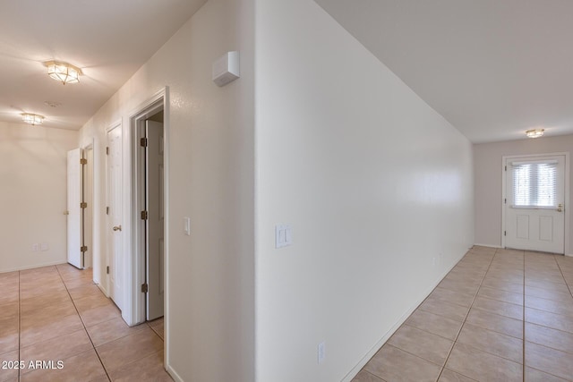 hall with light tile patterned flooring