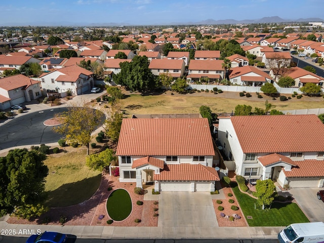 bird's eye view with a residential view and a mountain view