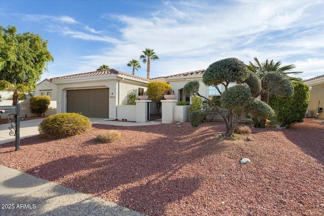 mediterranean / spanish home with a garage