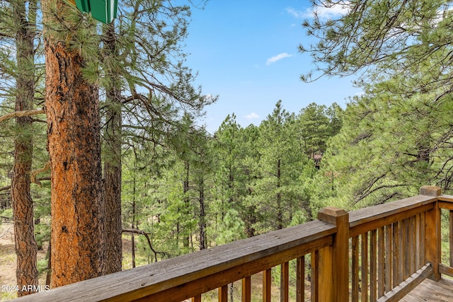 deck featuring a wooded view