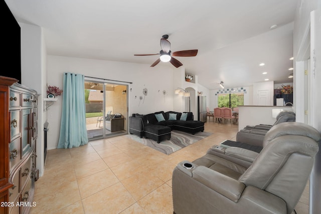 tiled living room with vaulted ceiling and ceiling fan