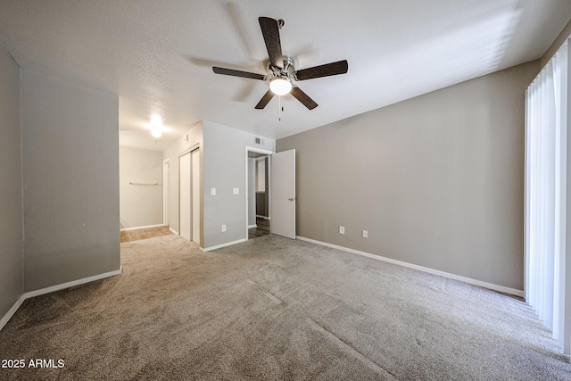 2025 E Campbell Ave Unit 137, Phoenix, AZ 85016 - unfurnished bedroom with carpet, a closet, and a ceiling fan