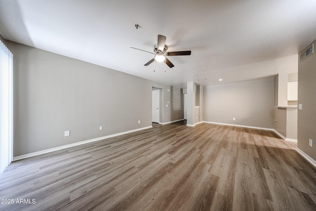 2025 E Campbell Ave Unit 137, Phoenix, AZ 85016 - unfurnished room featuring ceiling fan, wood finished floors, and a pendent fire sprinkler