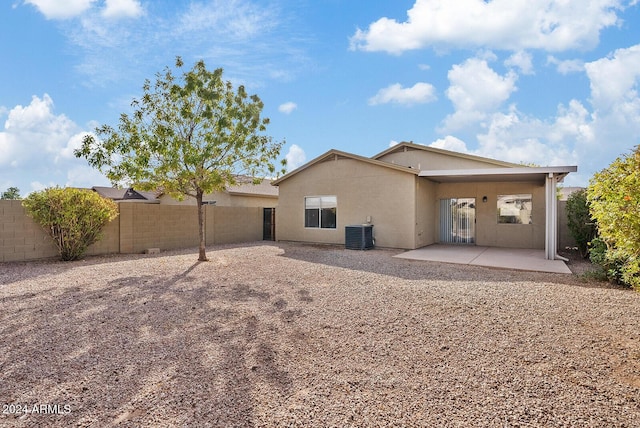 rear view of house with a patio area and central air condition unit