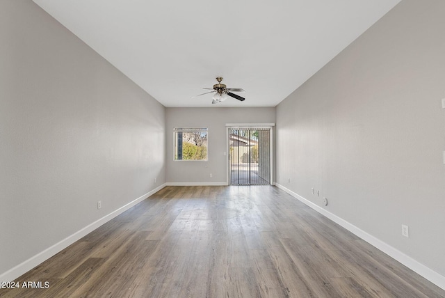 unfurnished room with ceiling fan and wood-type flooring