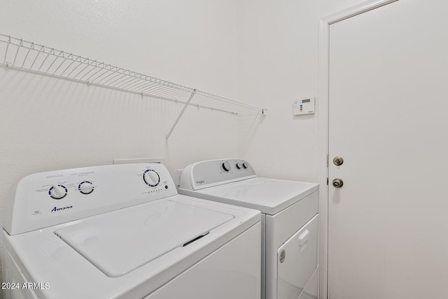 washroom featuring washer and dryer