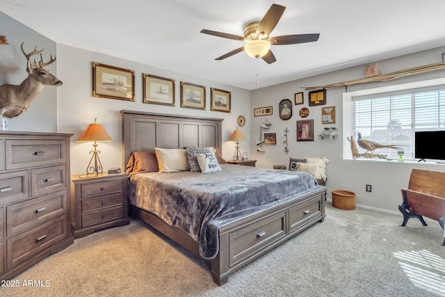 bedroom featuring ceiling fan and light carpet