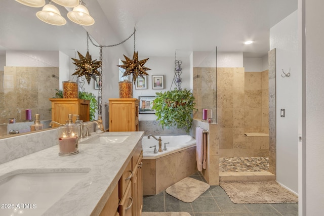 bathroom with vanity, tile patterned flooring, and shower with separate bathtub