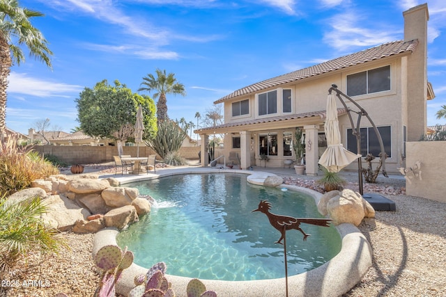 view of swimming pool with a patio area