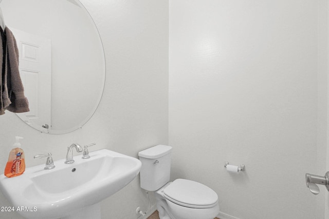 bathroom with toilet and sink