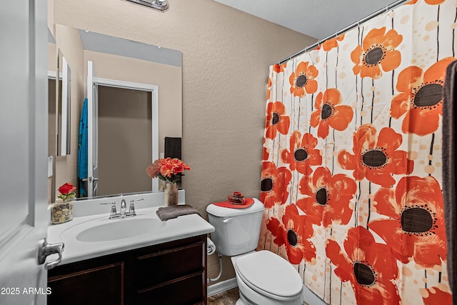 bathroom with vanity, toilet, and walk in shower