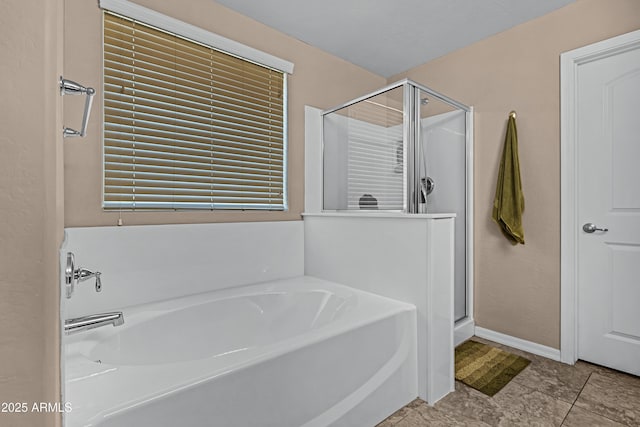 bathroom with independent shower and bath