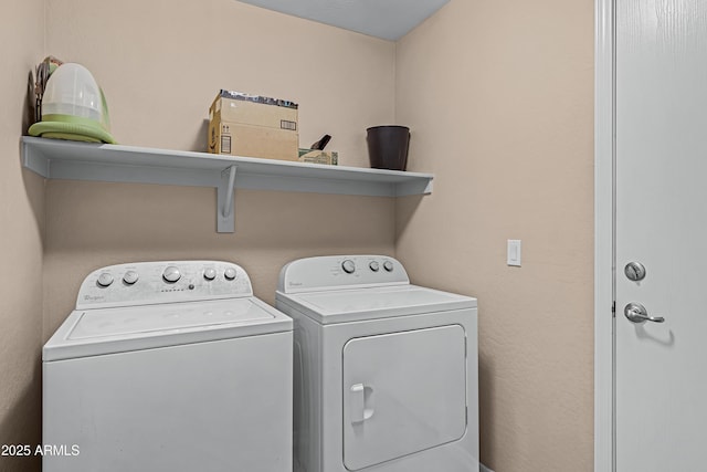 laundry room featuring washing machine and clothes dryer