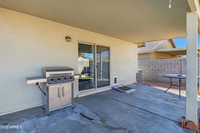 view of patio / terrace with grilling area and washer / clothes dryer