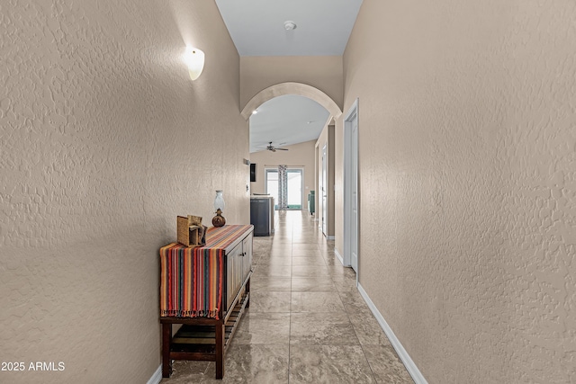 hall with vaulted ceiling